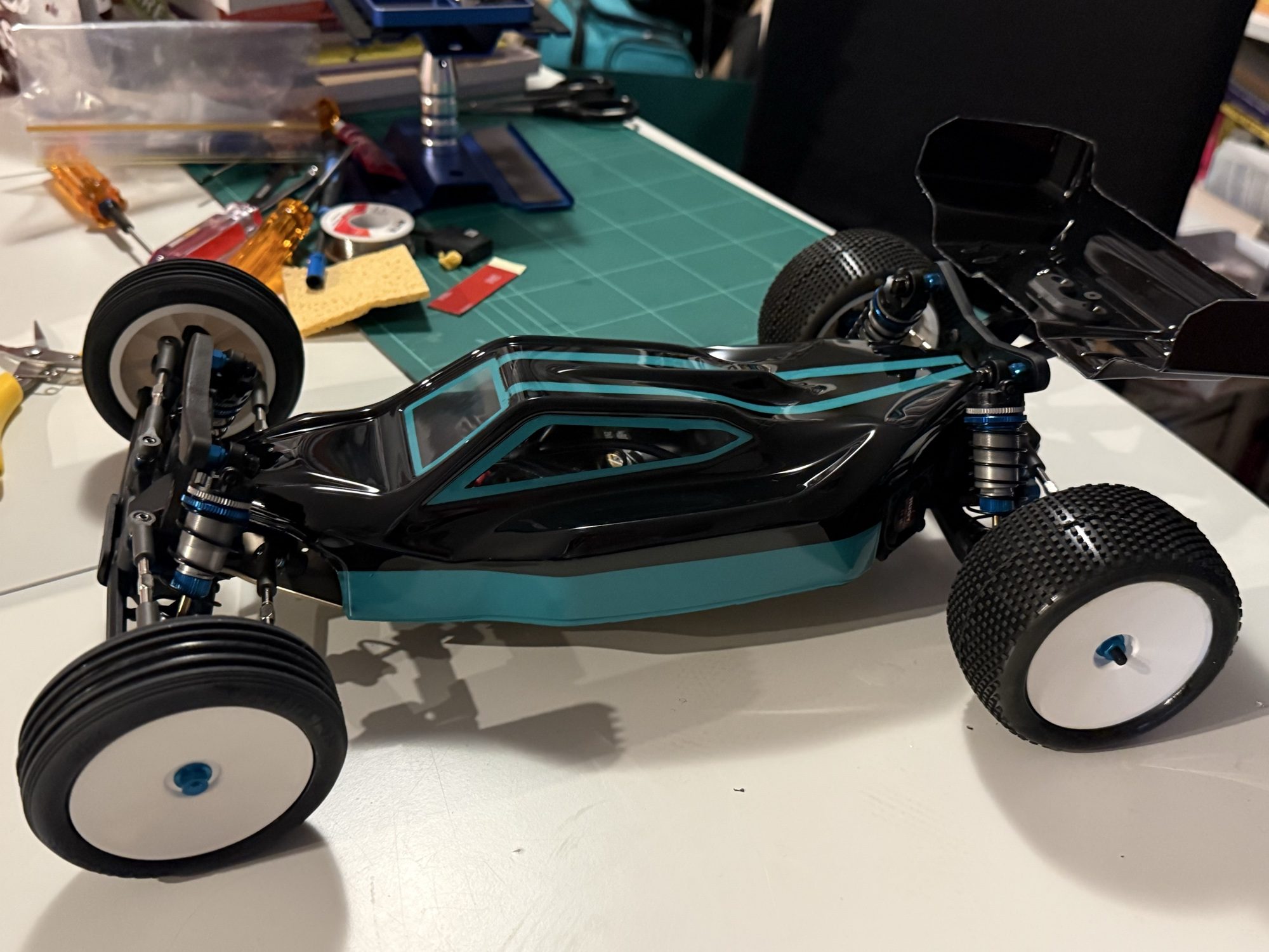 The Team Sheppard 2WD buggy on the workbench, fresh from a rebuild